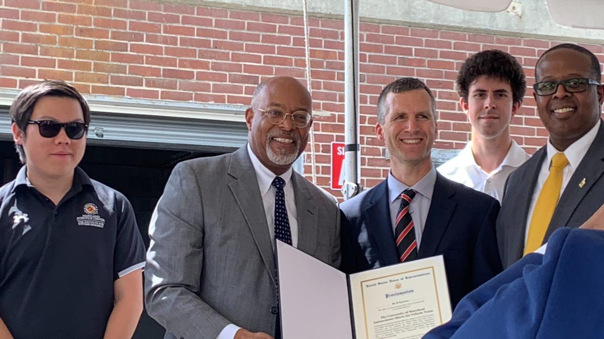 Rep. Glenn Ivey (D-Md.) presents a certificate to University of Maryland students during his visit to the Maryland Fire and Rescue Institute.