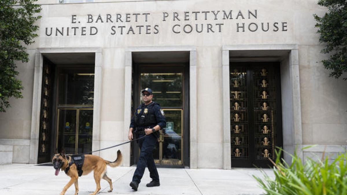A Homeland Security canine unit sweeps one of the entrances to the E. Barrett Prettyman United States Courthouse in Washington, DC, US, on August 3, 2023.