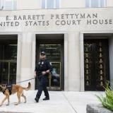 A Homeland Security canine unit sweeps one of the entrances to the E. Barrett Prettyman United States Courthouse in Washington, DC, US, on August 3, 2023.