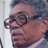 A photo of Tommie Broadwater being interviewed in his later years.