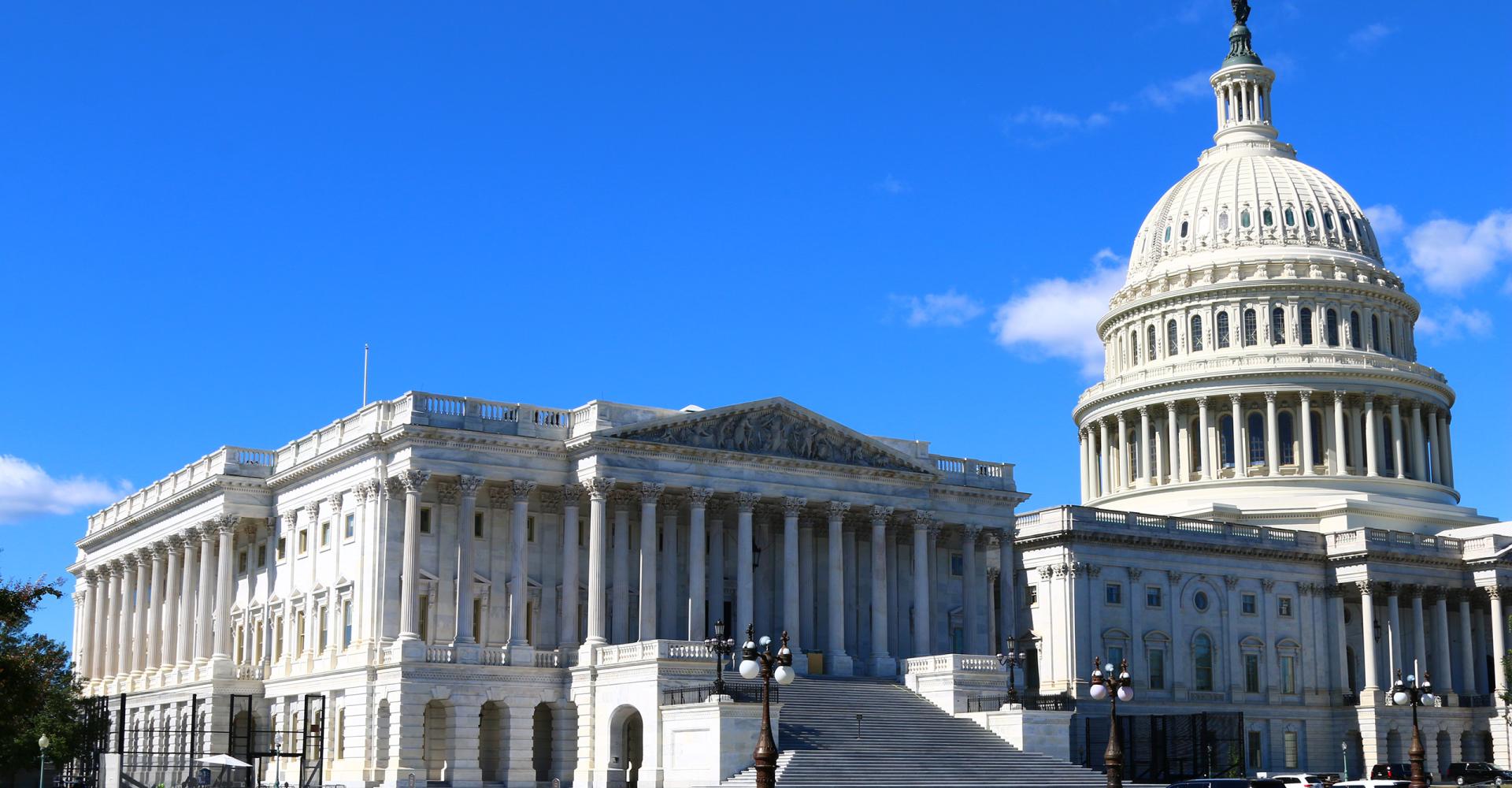 Capitol dome against blue sky